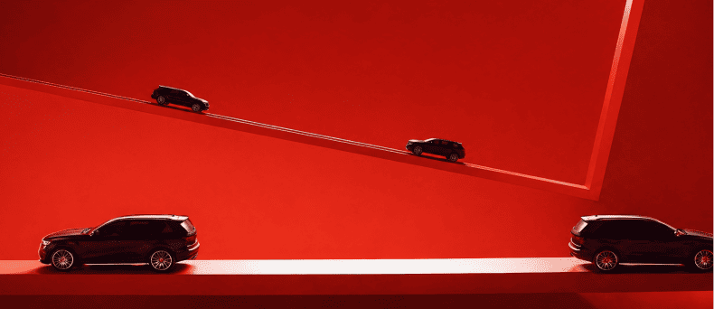 Car driving on a red elevated road