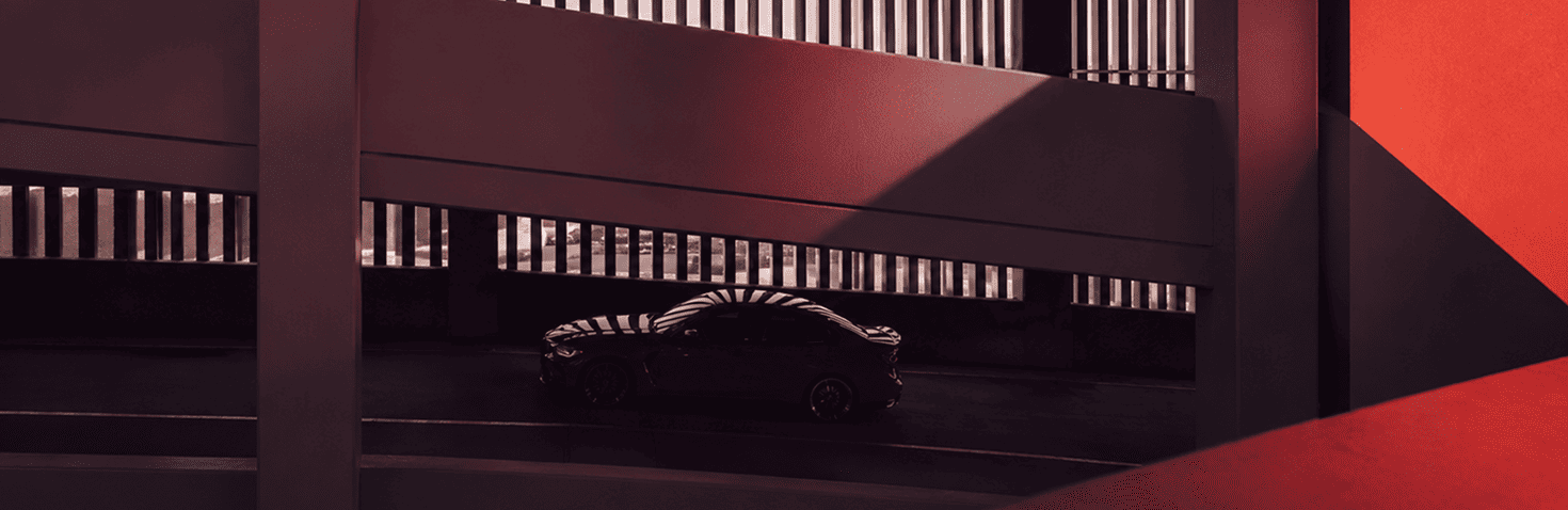 Black sports car in a modern architectural setting